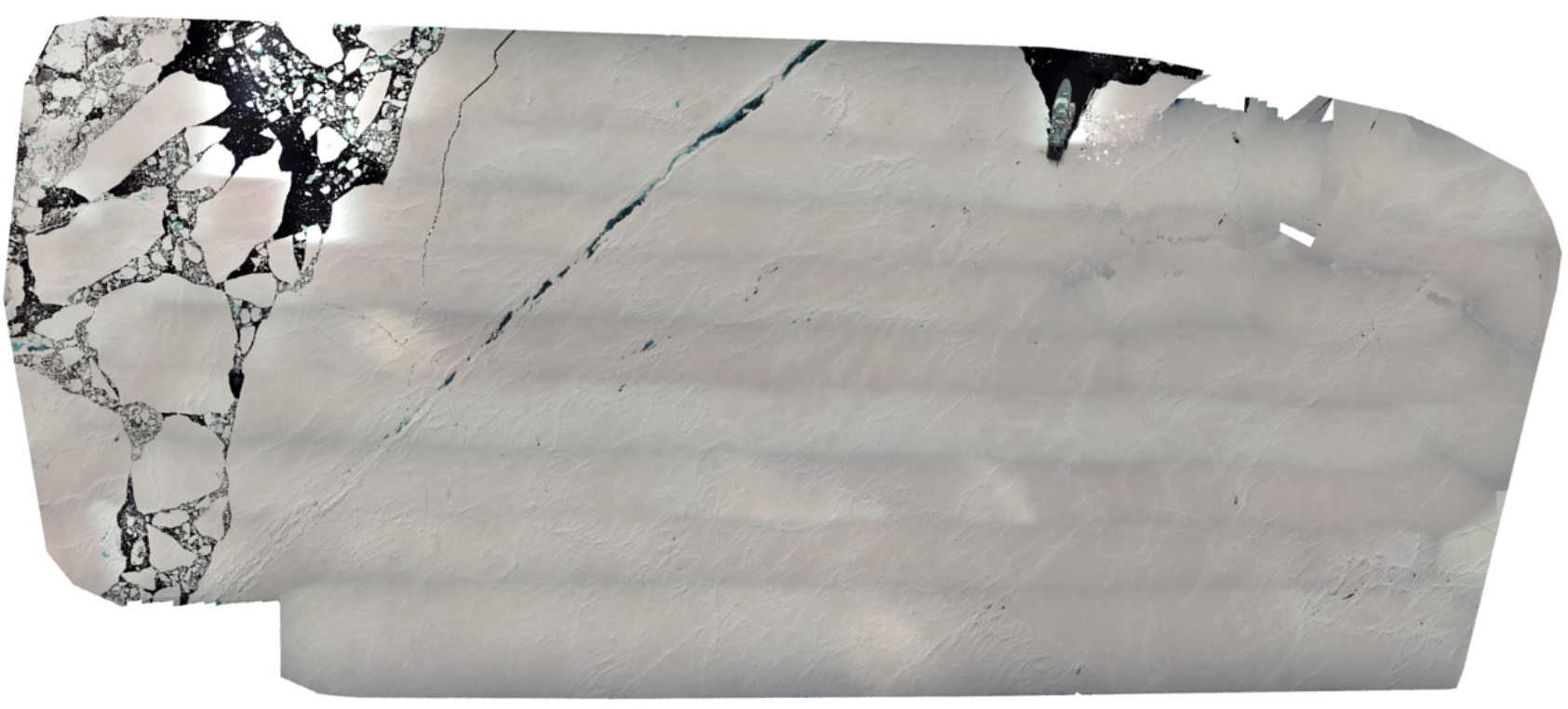Tom Rune Lauknes/NORCE, Drone orthomosaic of the fieldwork area. KV Svalbard was attached to a large ice floe with ridges of drifted snow or pressure ridges, and a large crack and open sea ice on the left side., Figure 62, , 