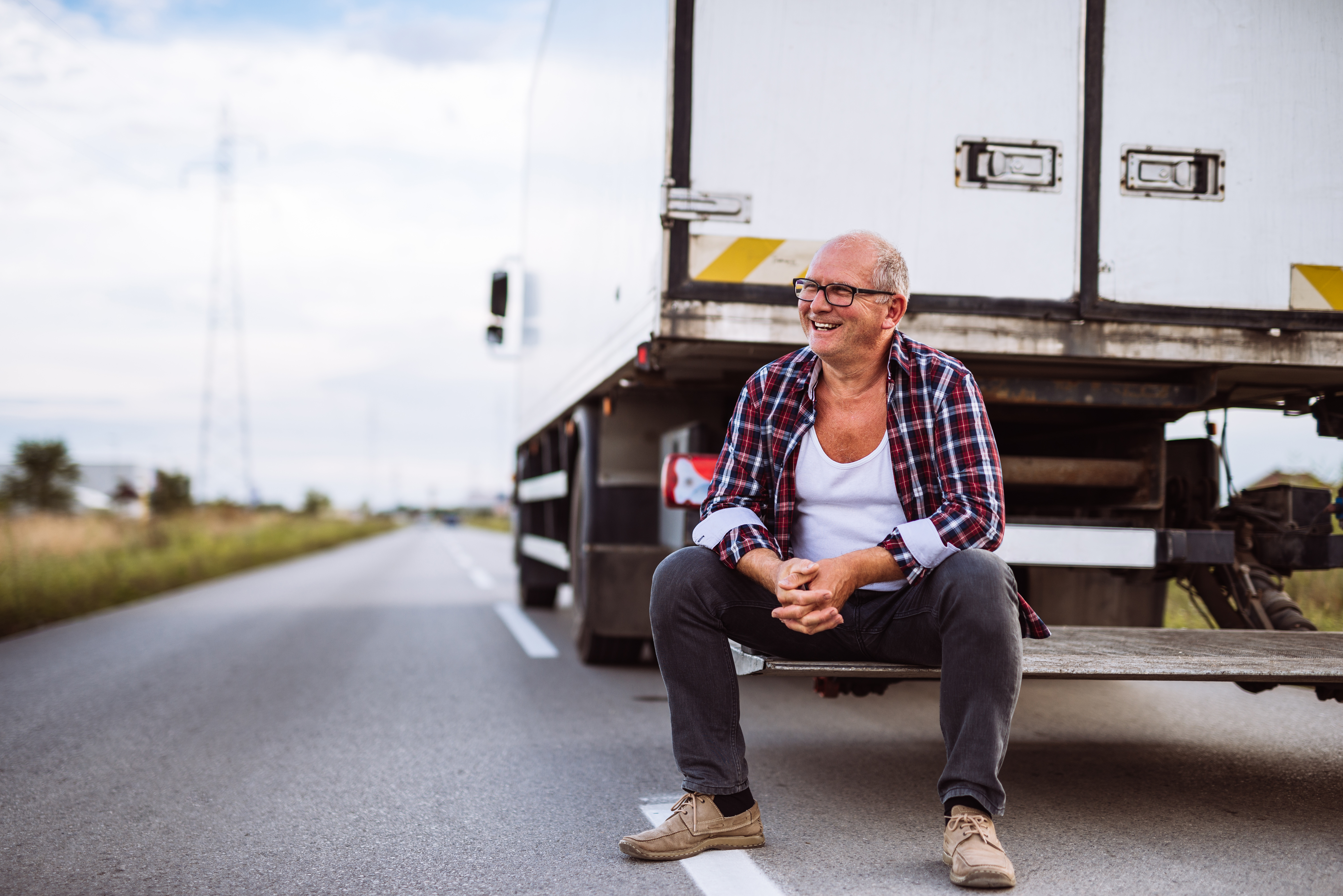 , , Stock photo senior truck driver posing next to his truck 488919055, ,
